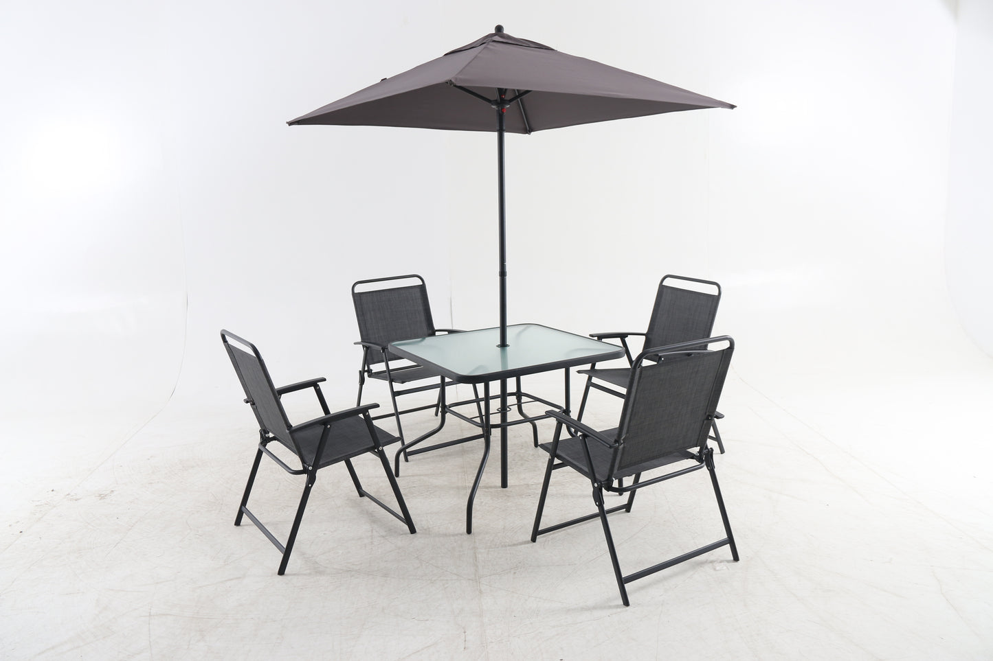 Glass top patio dining set with four black mesh chairs and umbrella