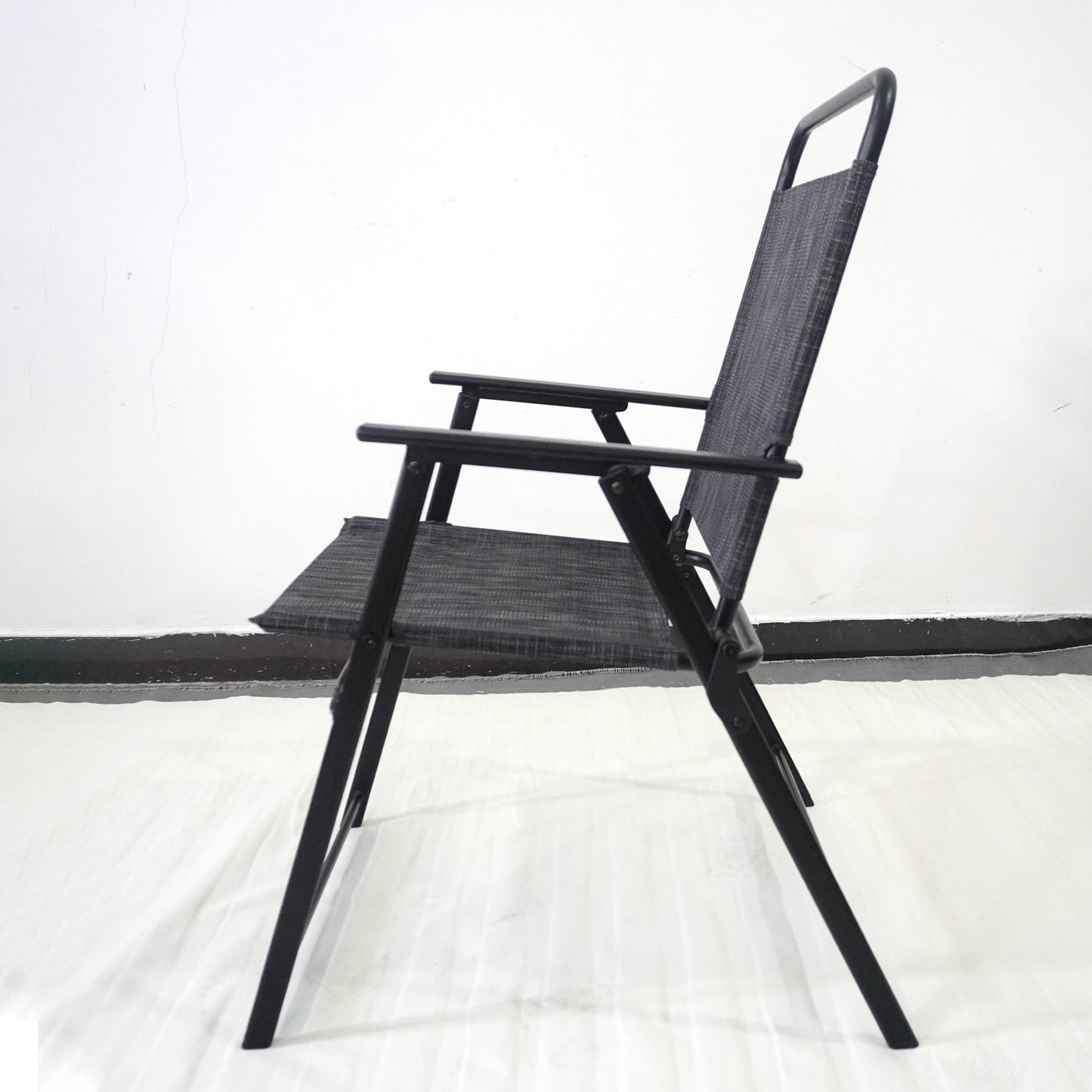 Black foldable patio chair with dark gray fabric seat and back