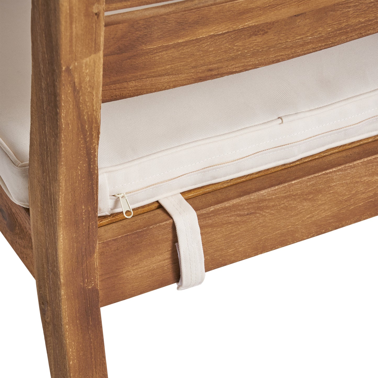 Closeup of wooden outdoor chair frame with cream cushion detail