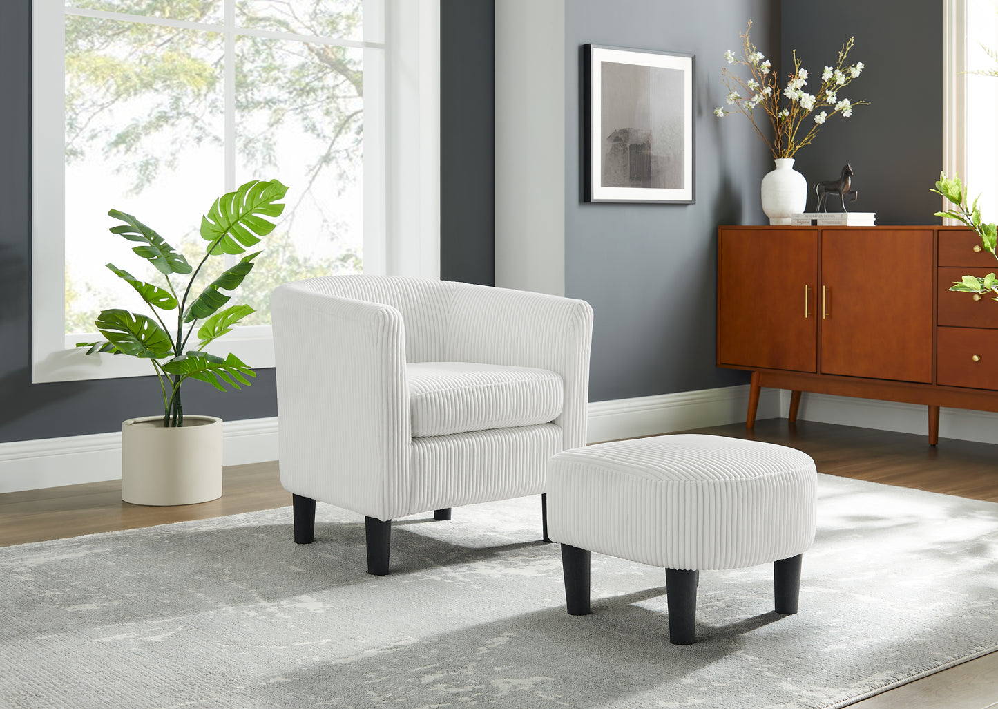 Cozy white corduroy armchair with textured upholstery and black legs perfect for living rooms