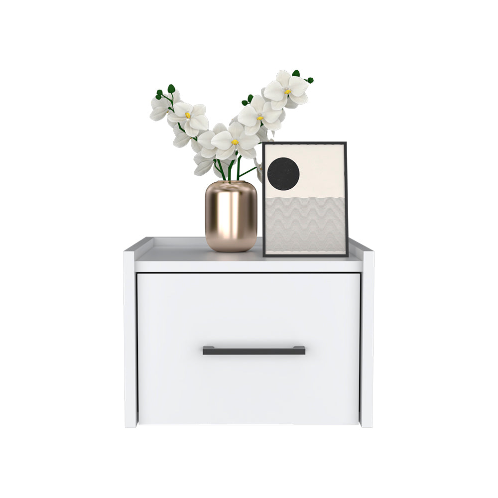 Modern white bedside table with a gold vase of white orchids and abstract art
