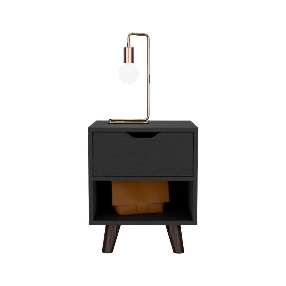 Black bedside table with one drawer and open shelf featuring a modern table lamp