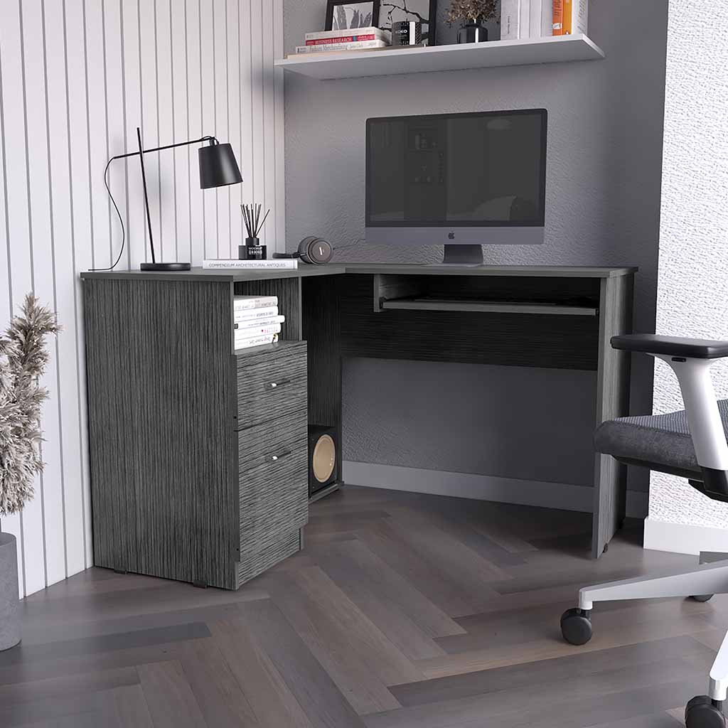 Modern lshaped desk in grey wood finish with drawers and computer setup
