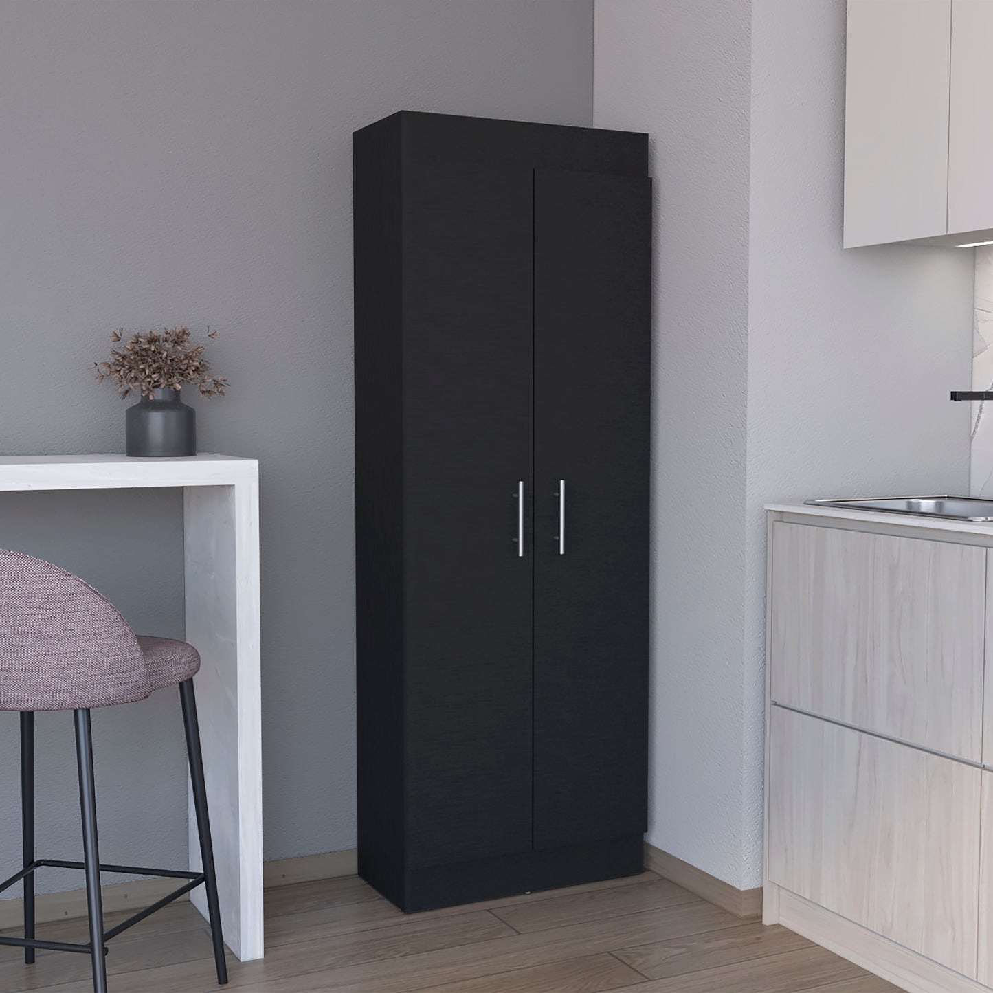Tall black pantry cabinet with two silver handle doors providing ample kitchen storage