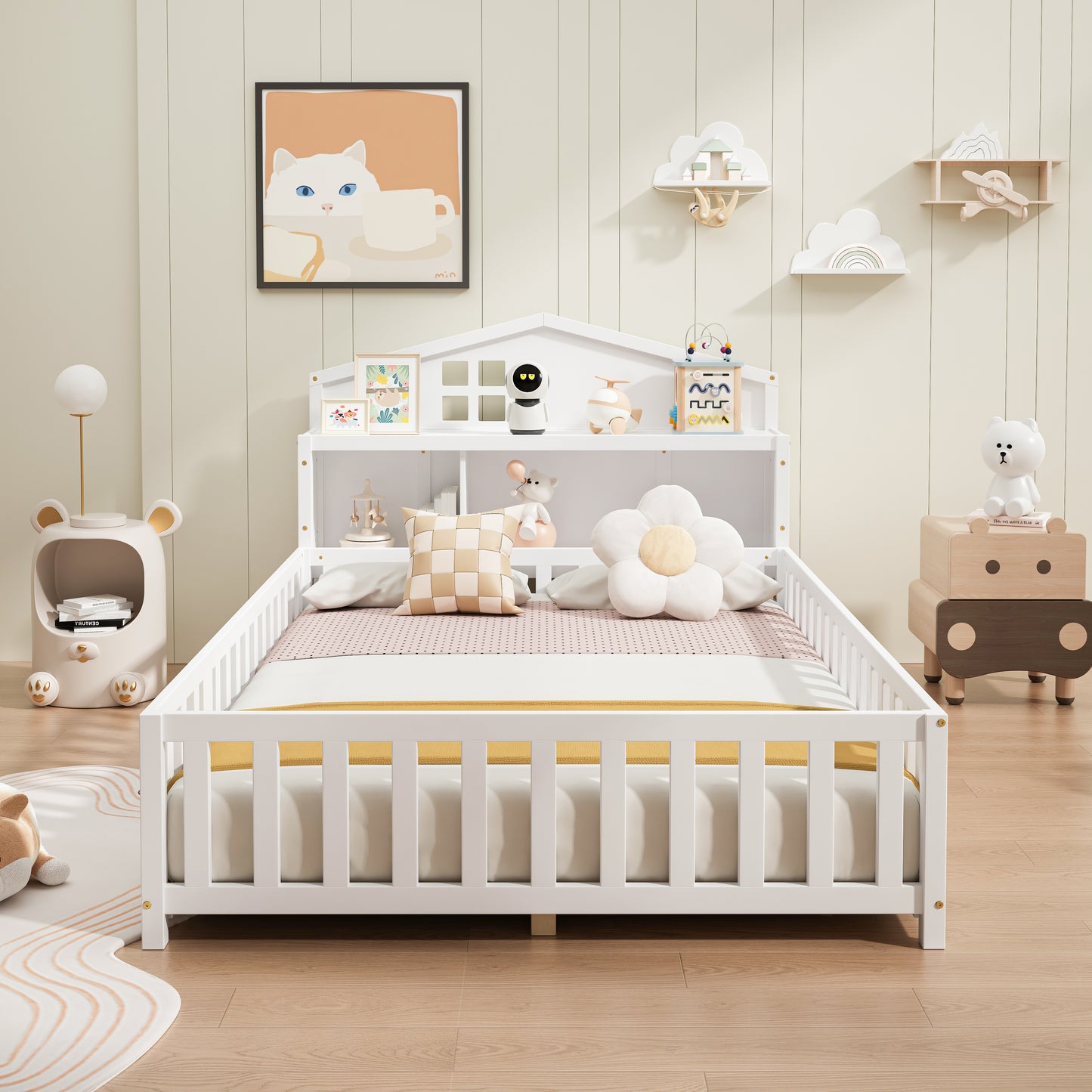 White wooden toddler bed with integrated bookshelf and cloudshaped shelves