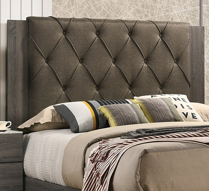 Tufted charcoal grey upholstered king headboard with wood trim