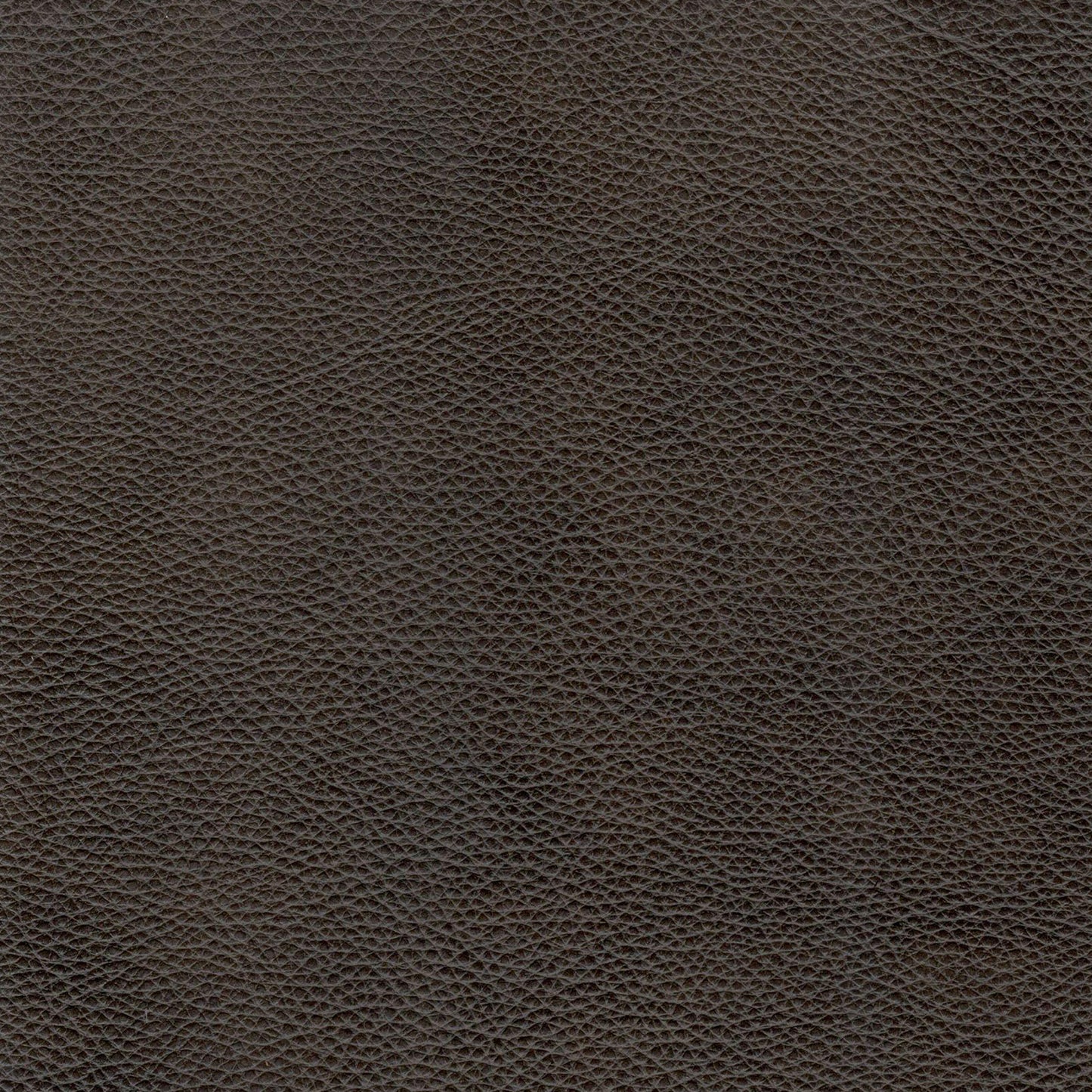 Closeup texture of dark brown pebble grain genuine leather ideal for upholstery