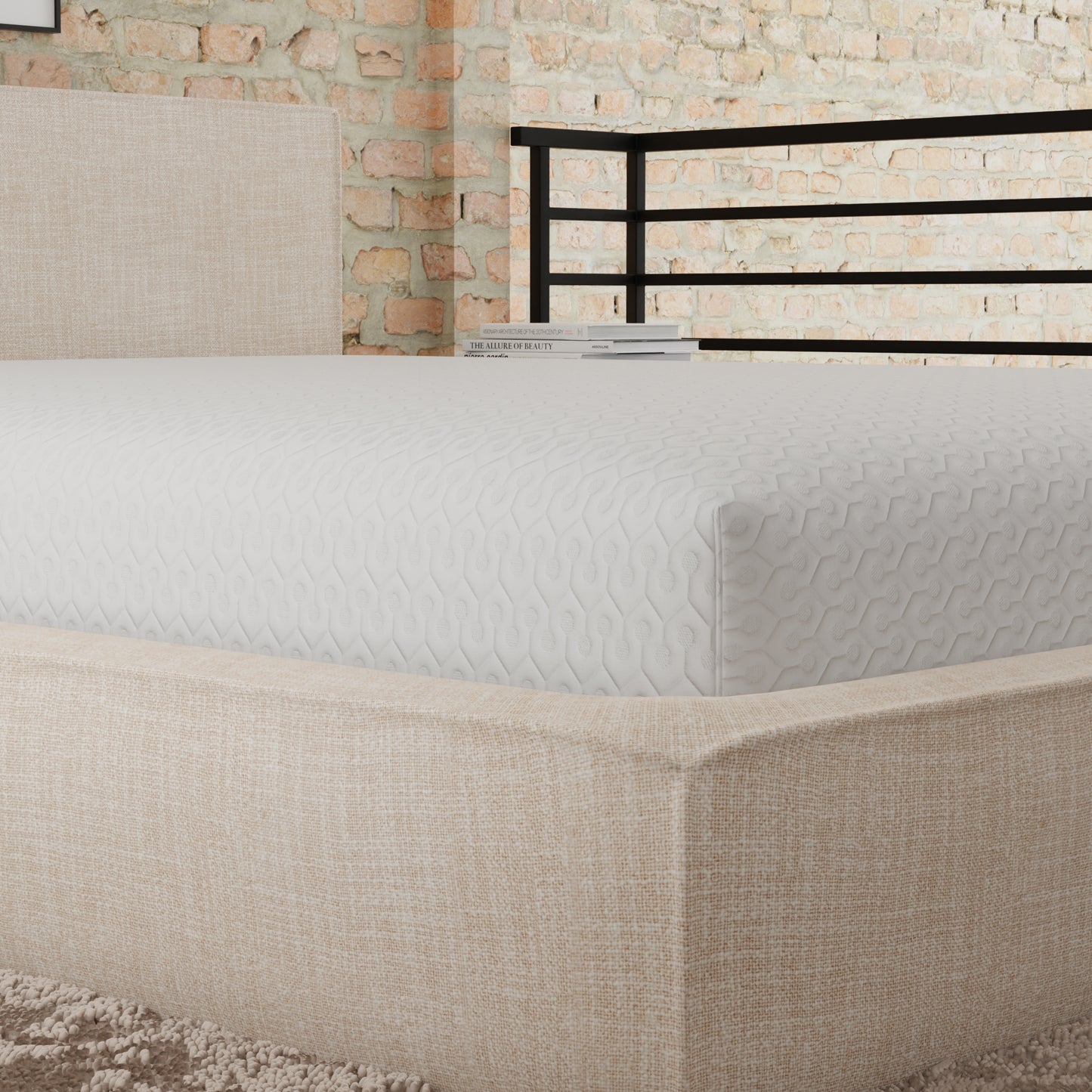White quilted memory foam mattress with geometric pattern on a beige upholstered bed frame