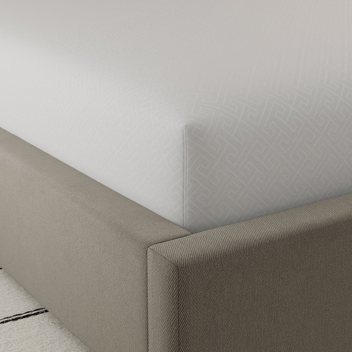 Crisp white fitted sheet with subtle Greek key pattern made from breathable cotton