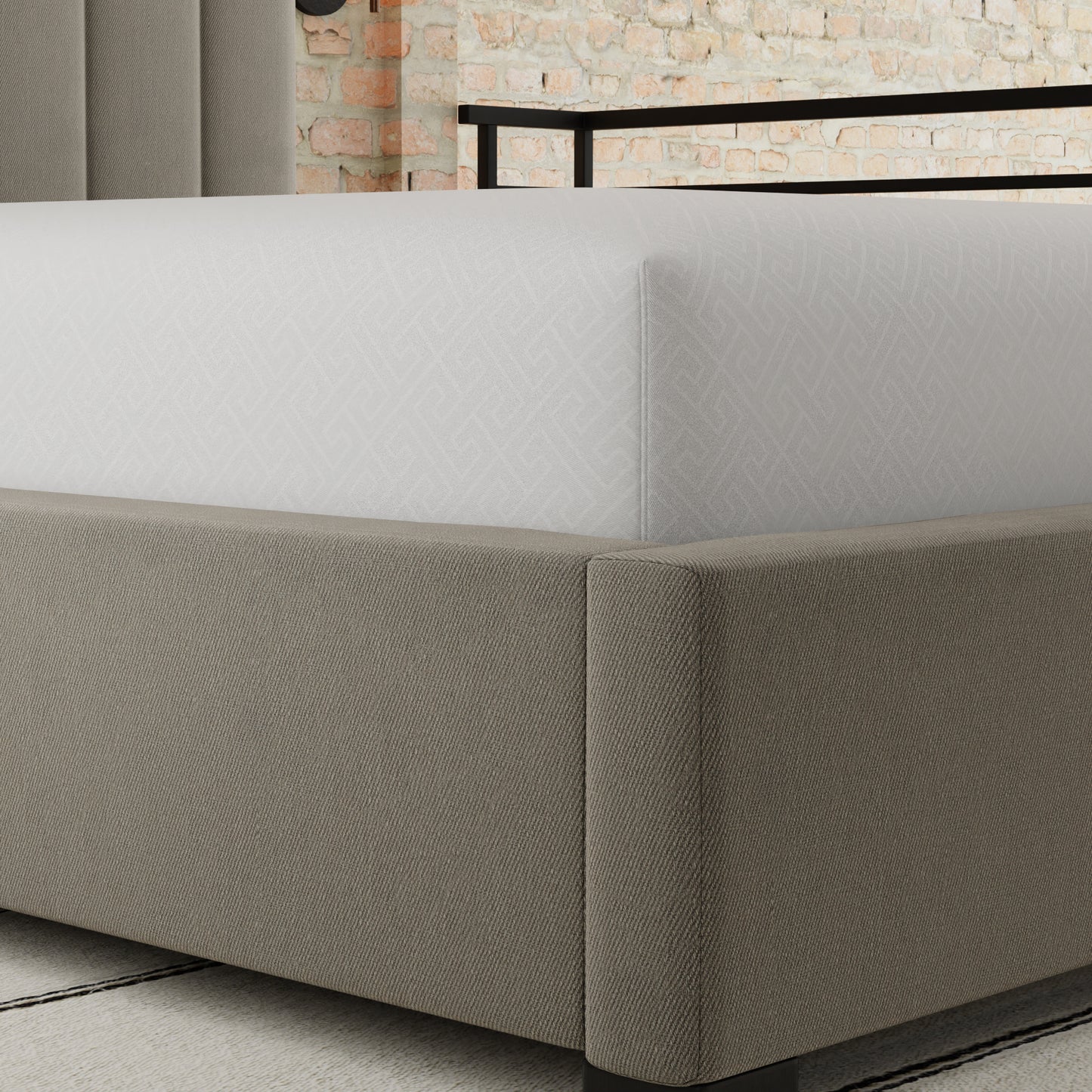Upholstered beige bed frame with white geometric patterned fitted sheet