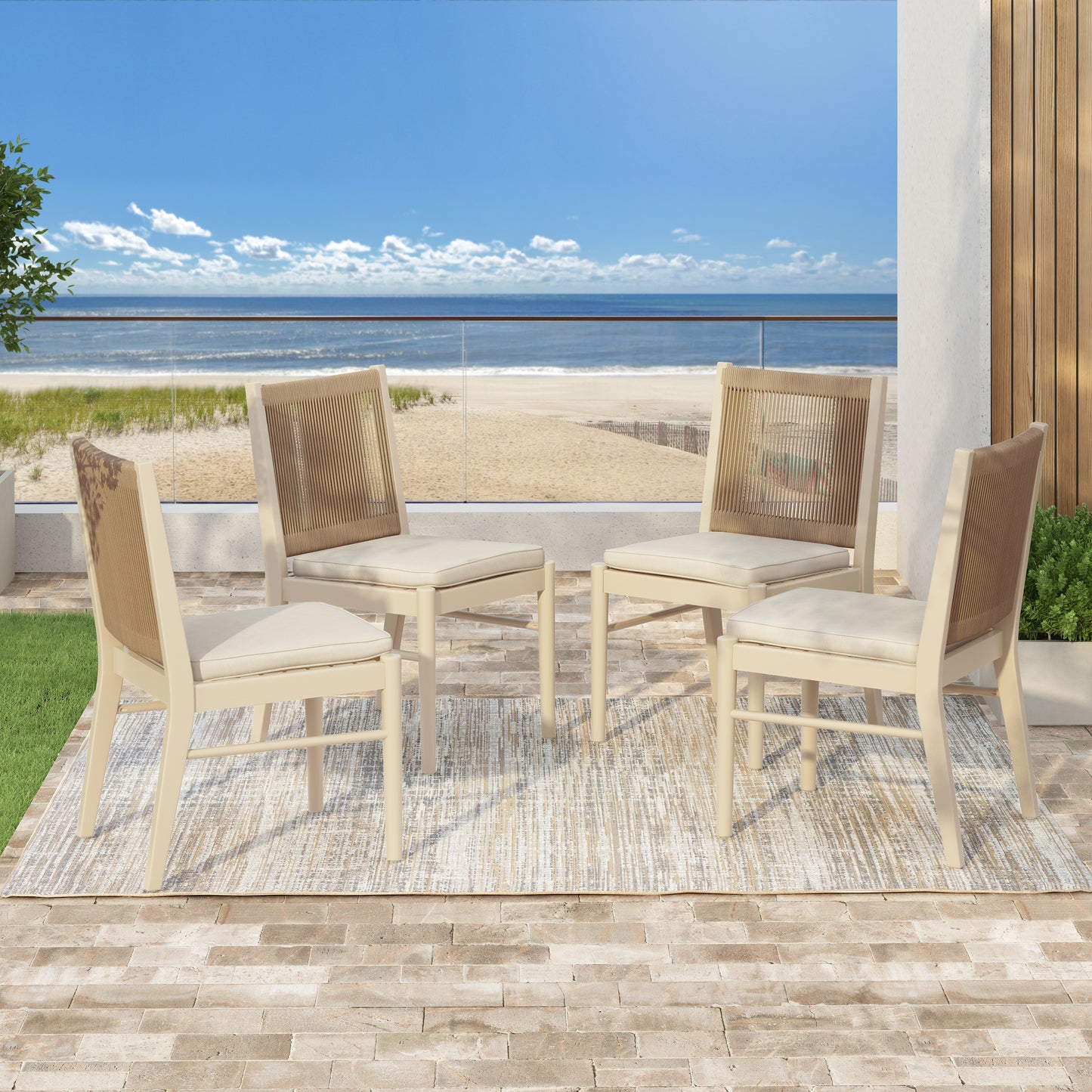 Set of four neutral upholstered dining chairs with woven backs on patio