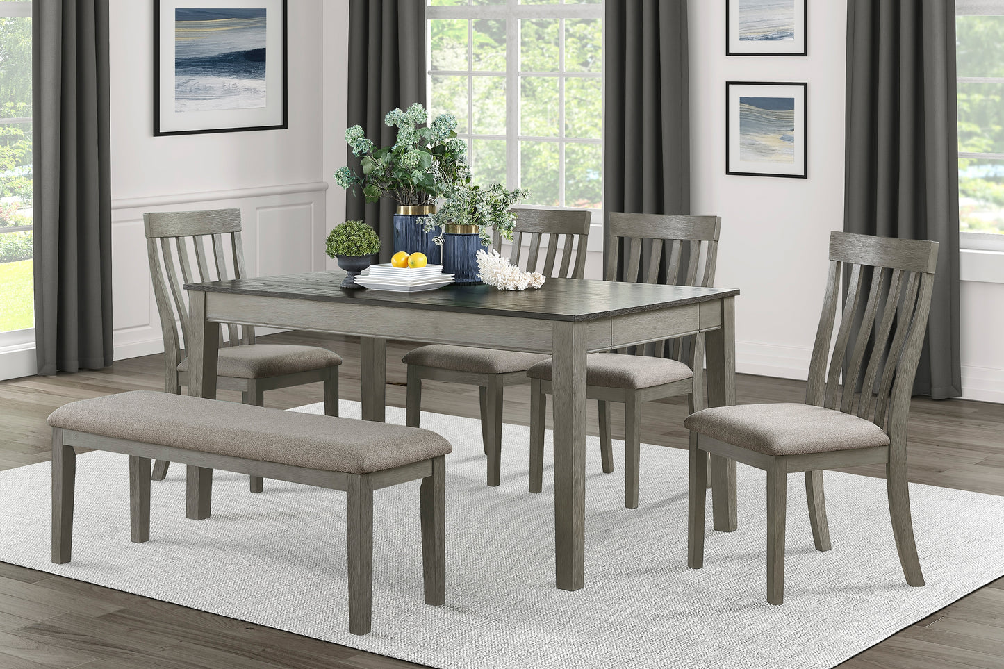 Gray wash dining table with slatted chairs and upholstered bench
