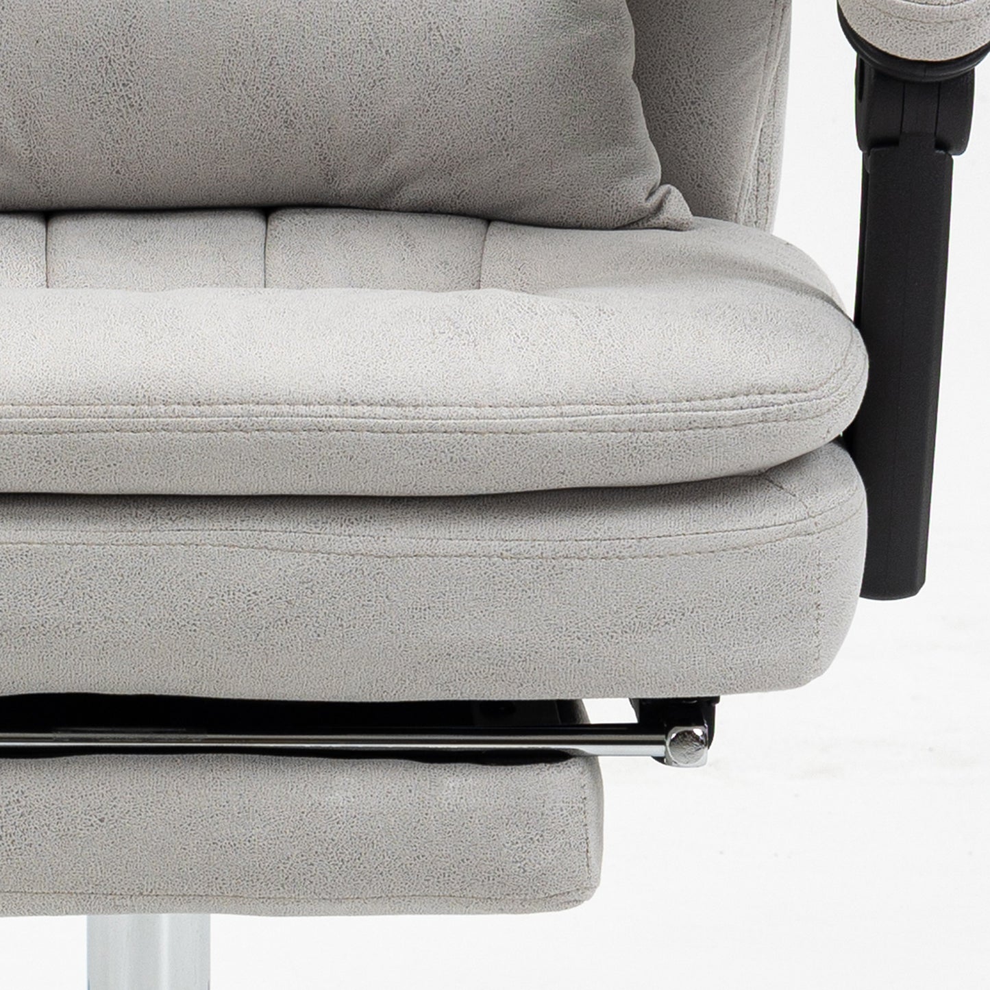 Closeup of plush grey fabric office chair seat with stitched detailing