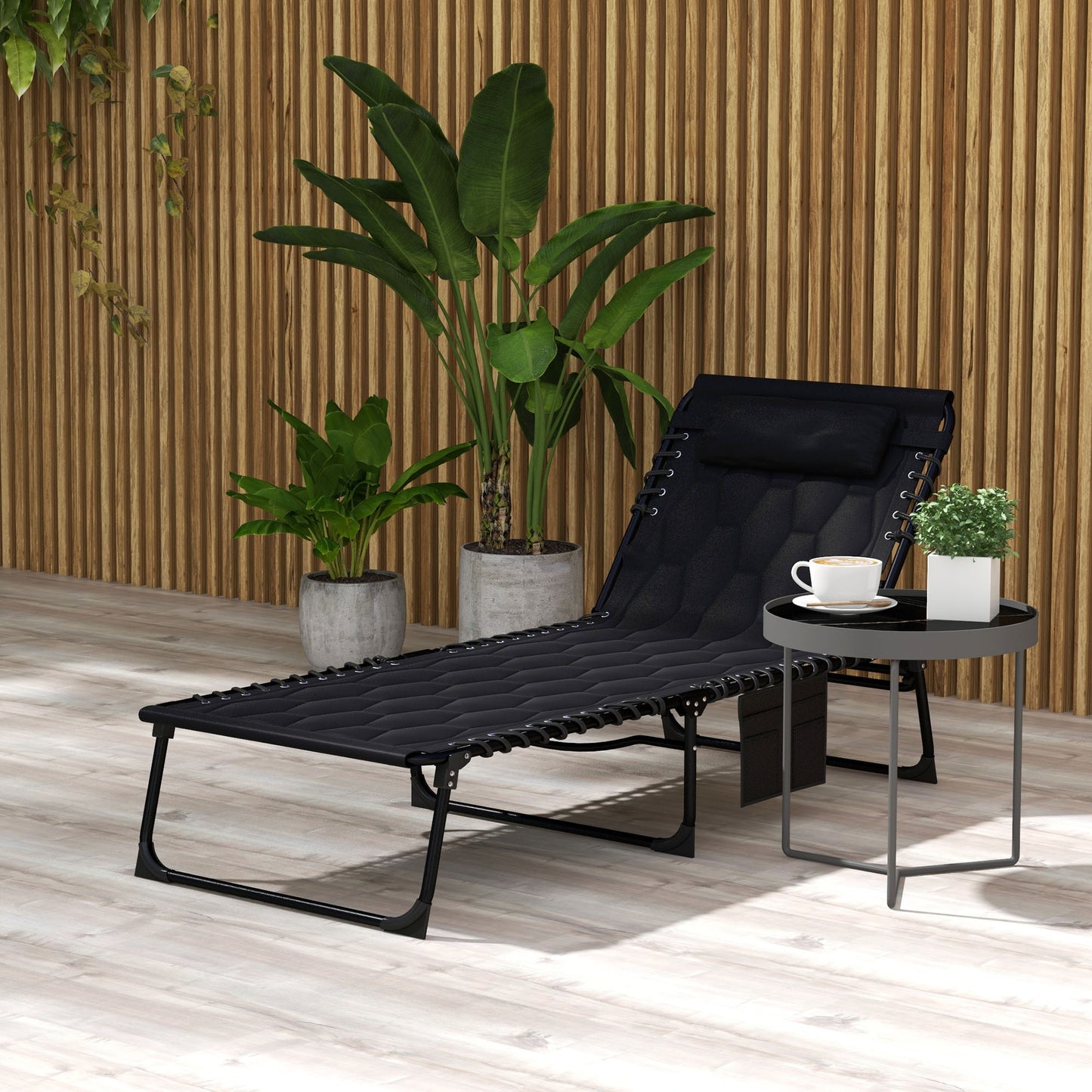 Black mesh zero gravity chair with adjustable headrest and padded seat for outdoor relaxation
