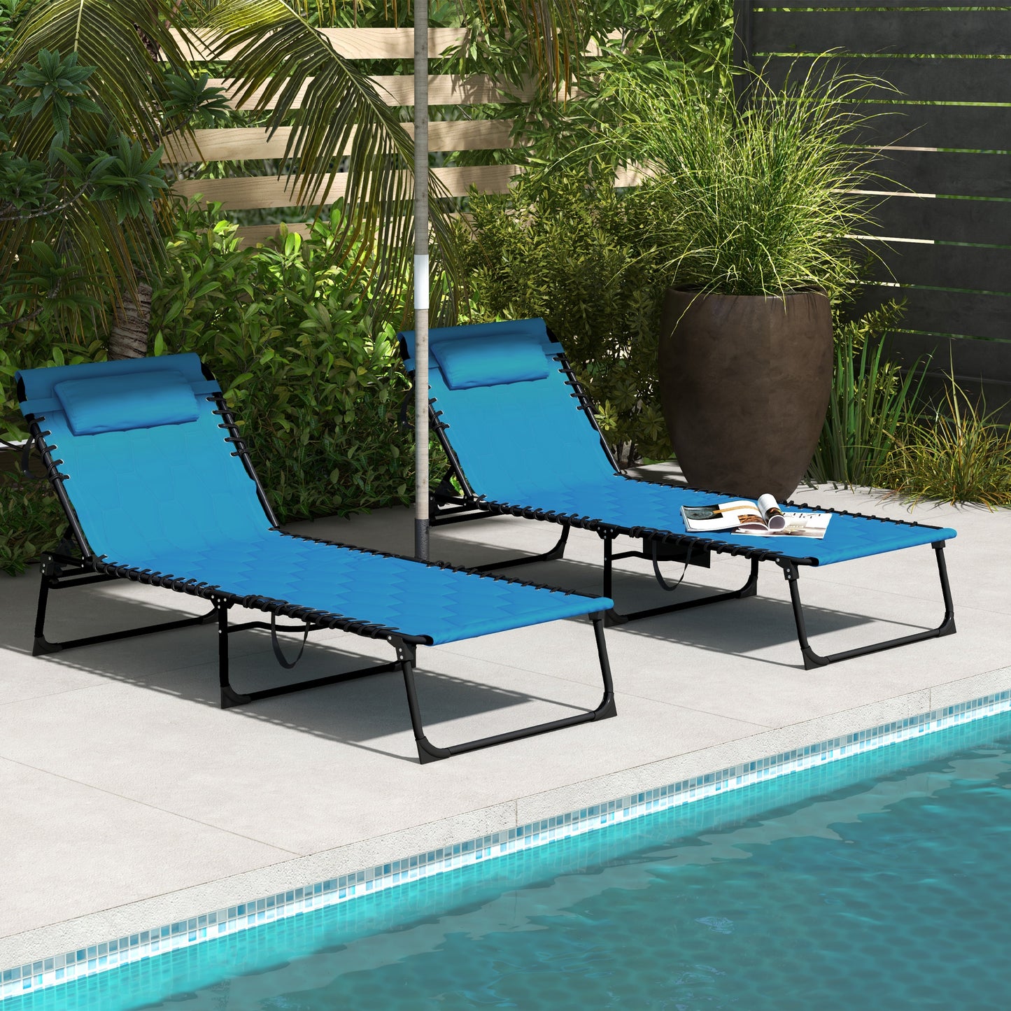 Two blue fabric lounge chairs with headrests by a pool perfect for relaxing poolside