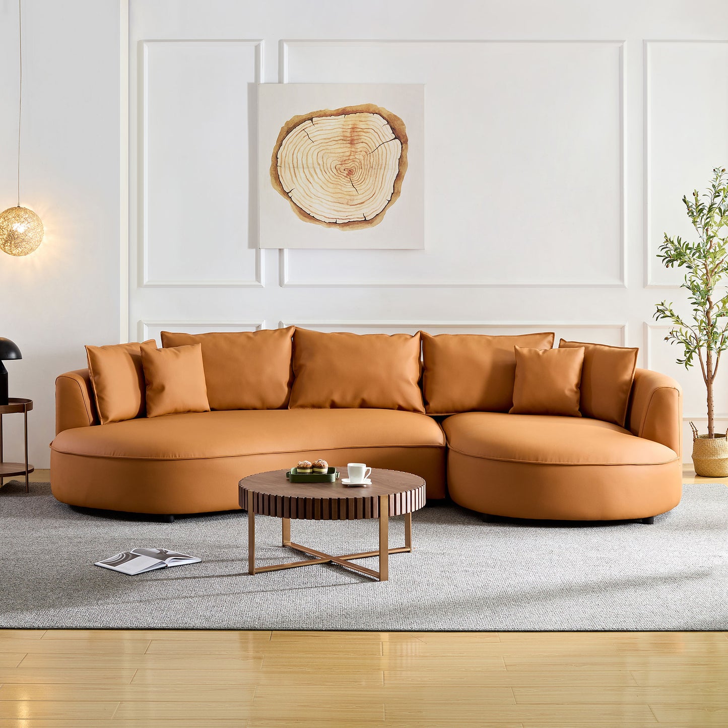 Spacious caramel leather sectional sofa with plush throw pillows perfect for modern living rooms