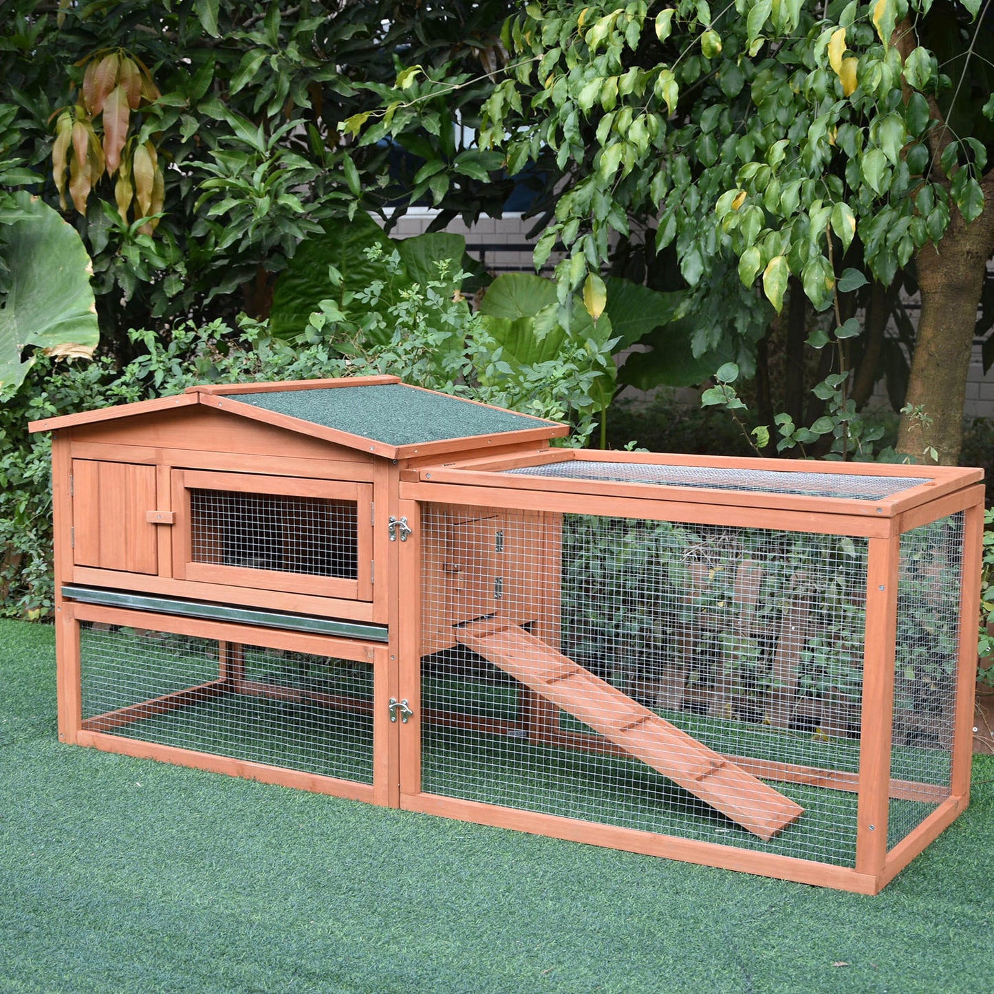 Wooden twotier rabbit hutch with green asphalt roof and ramp