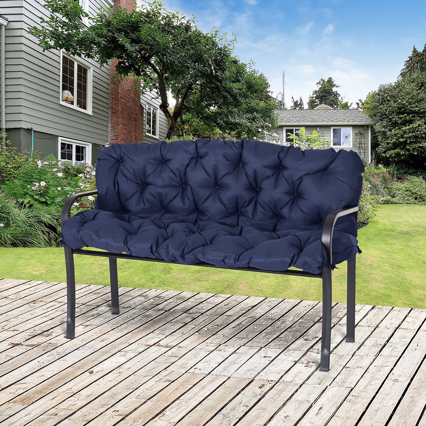 Navy tufted bench cushion with deep channel stitching on a metal bench