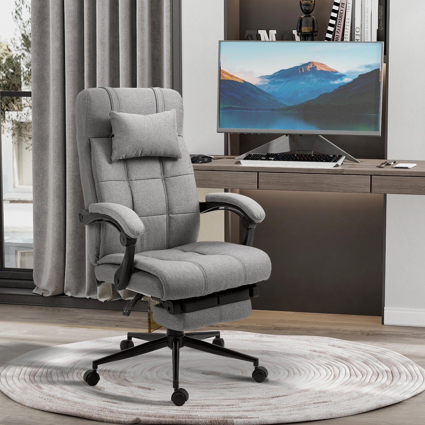 Gray fabric ergonomic office chair with lumbar support and footrest