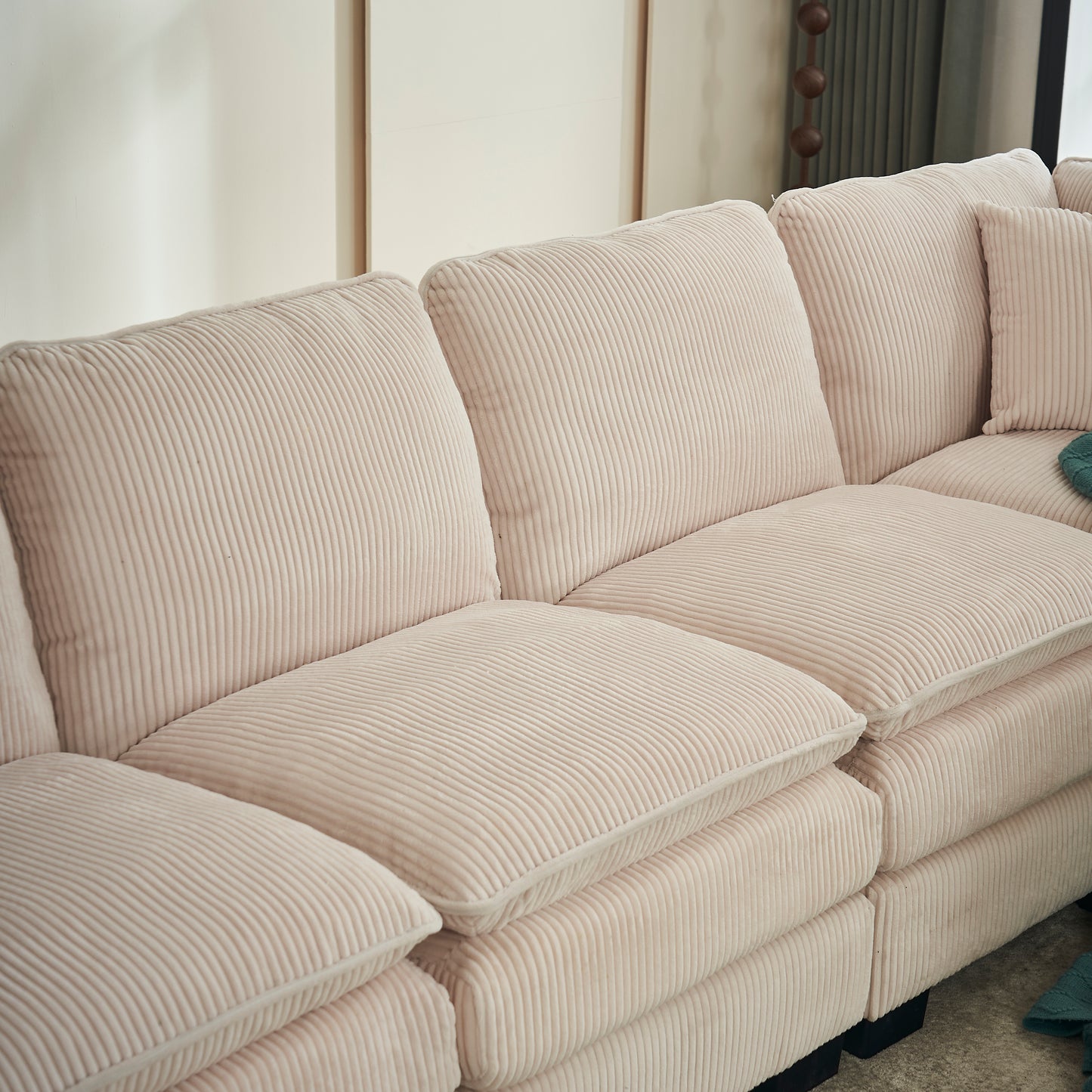 Plush cream corduroy sectional sofa with deep seats and comfortable cushions