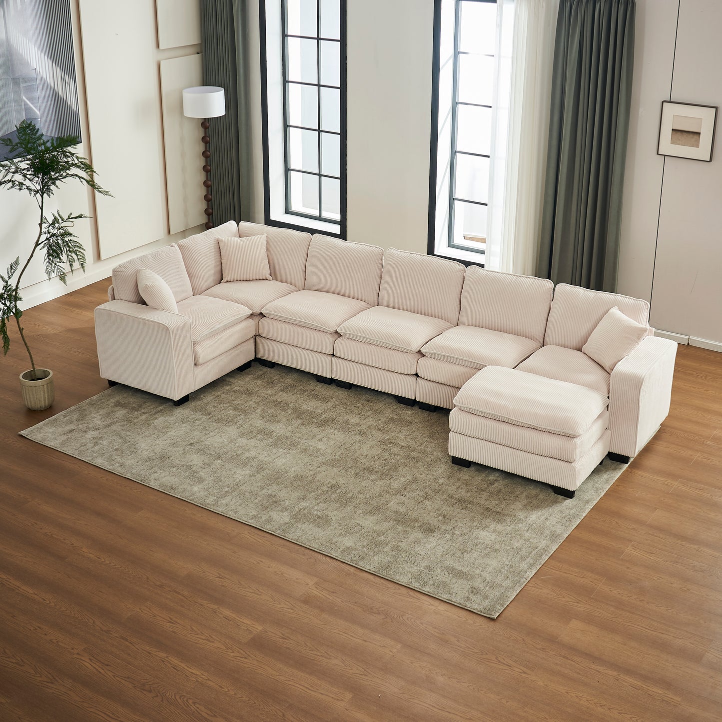 Light pink corduroy sectional sofa with plush cushions perfect for a modern living room