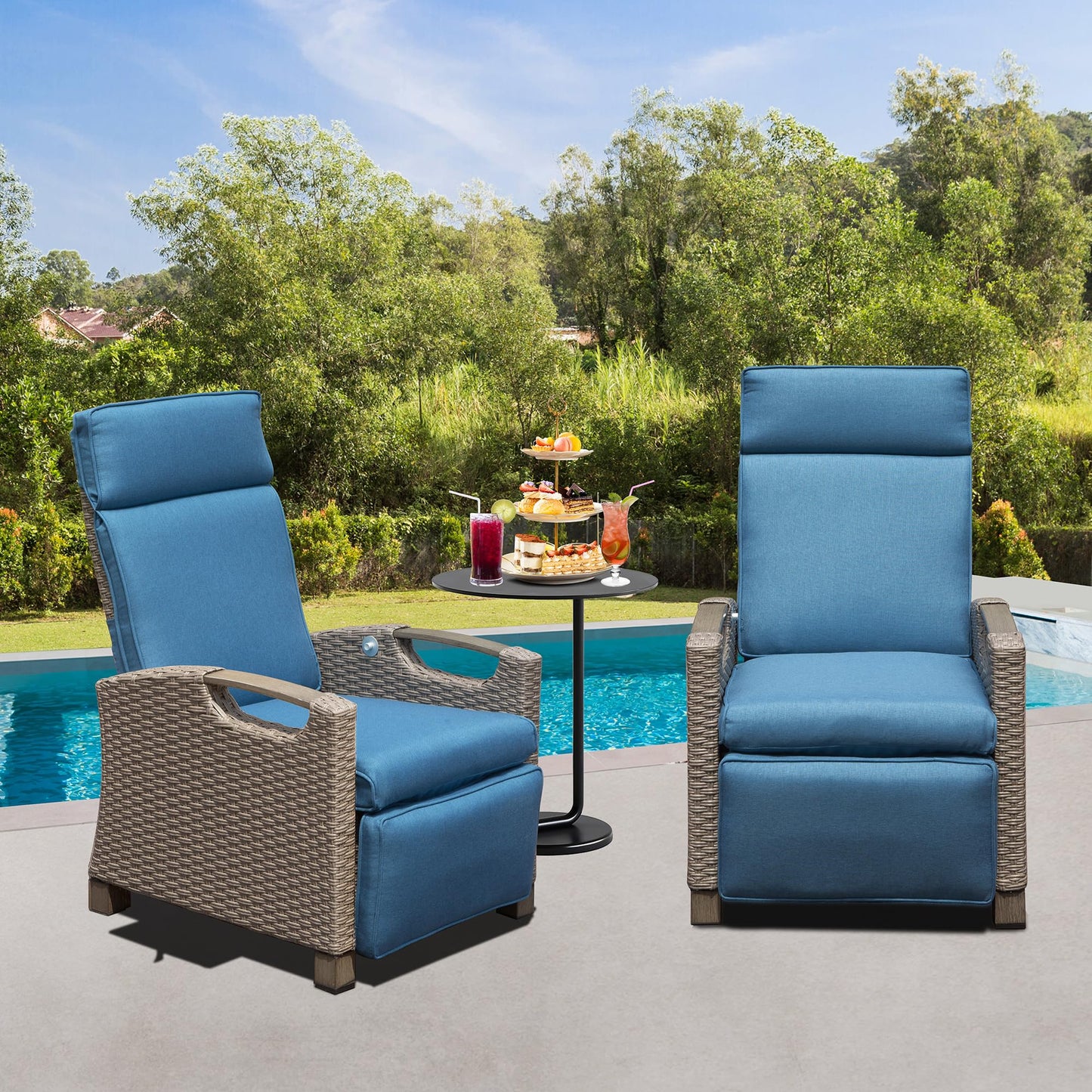 Two comfortable blue cushioned wicker patio chairs with side tables by a pool perfect for outdoor relaxation