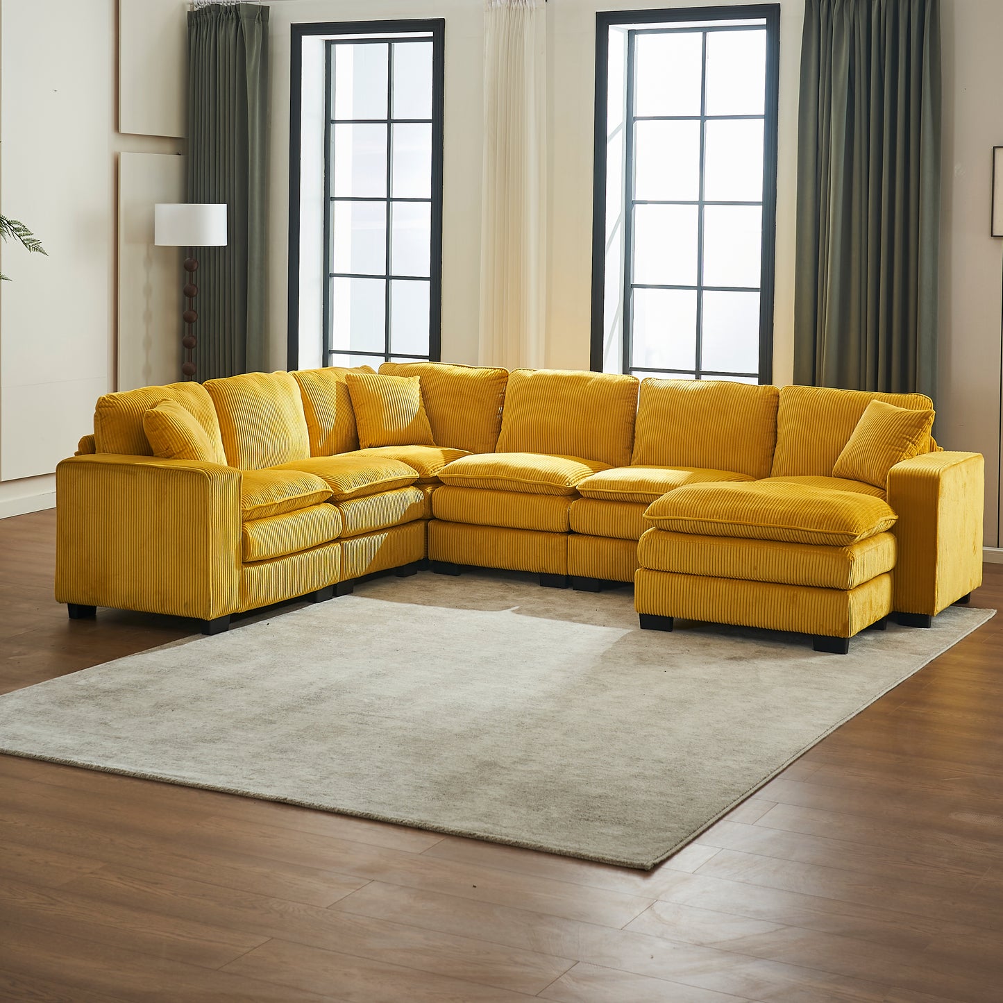 Comfortable yellow corduroy sectional sofa with plush cushions for a cozy living room