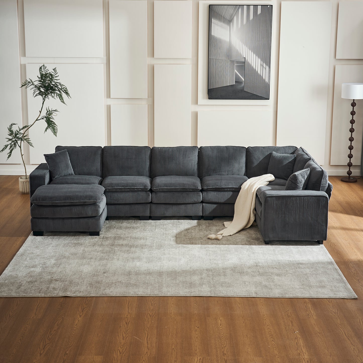 Dark grey corduroy sectional sofa with chaise and accent pillows for living rooms