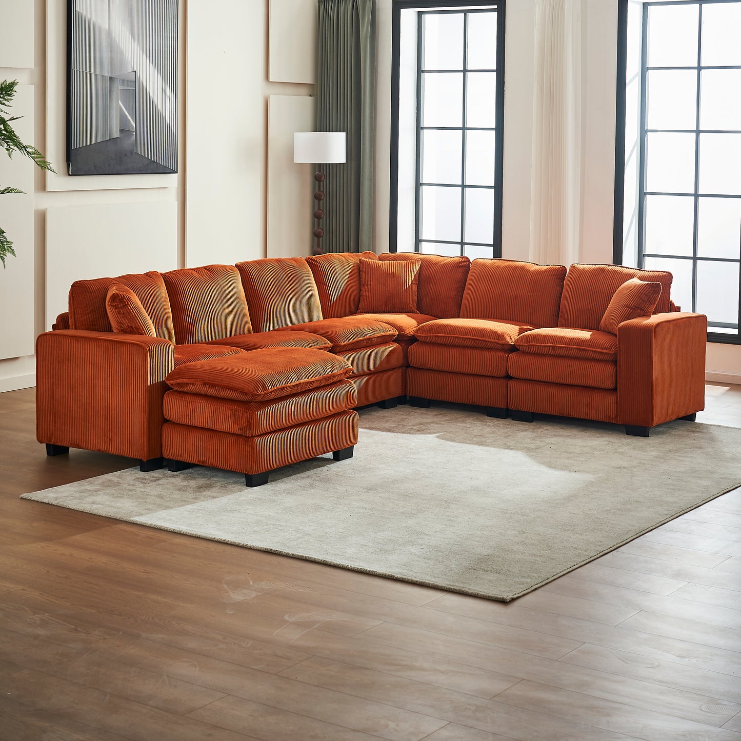 Ornate orange corduroy sectional sofa with plush cushions and ottoman for living room comfort
