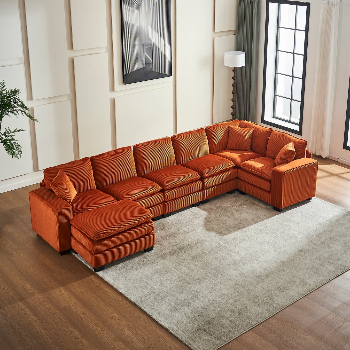 Ushaped orange corduroy sectional sofa with chaise and ottoman for spacious living rooms