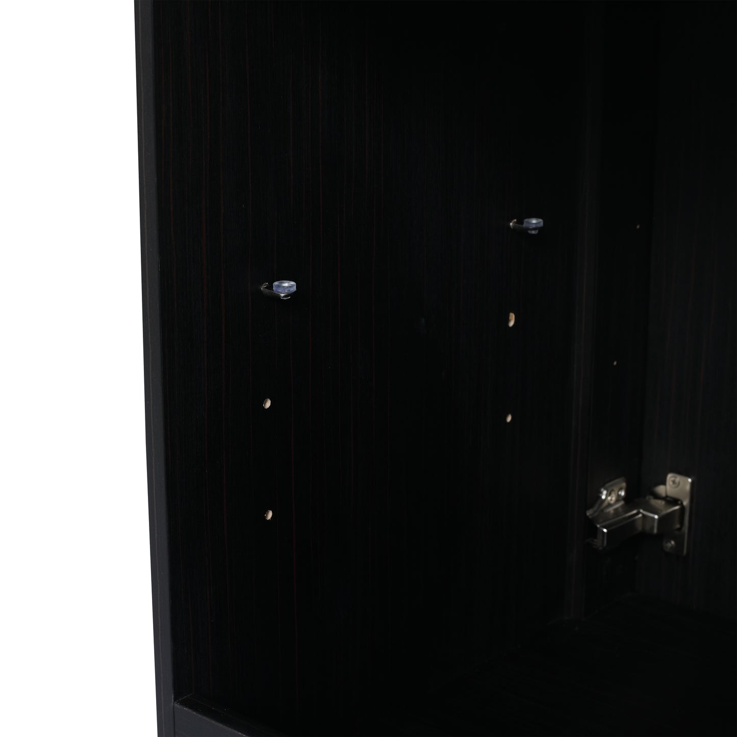 Dark wood cabinet interior with visible shelf pegs and a cabinet hinge