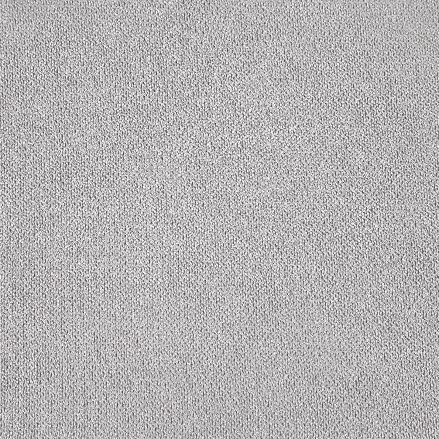 Closeup of light gray knit fabric with visible texture