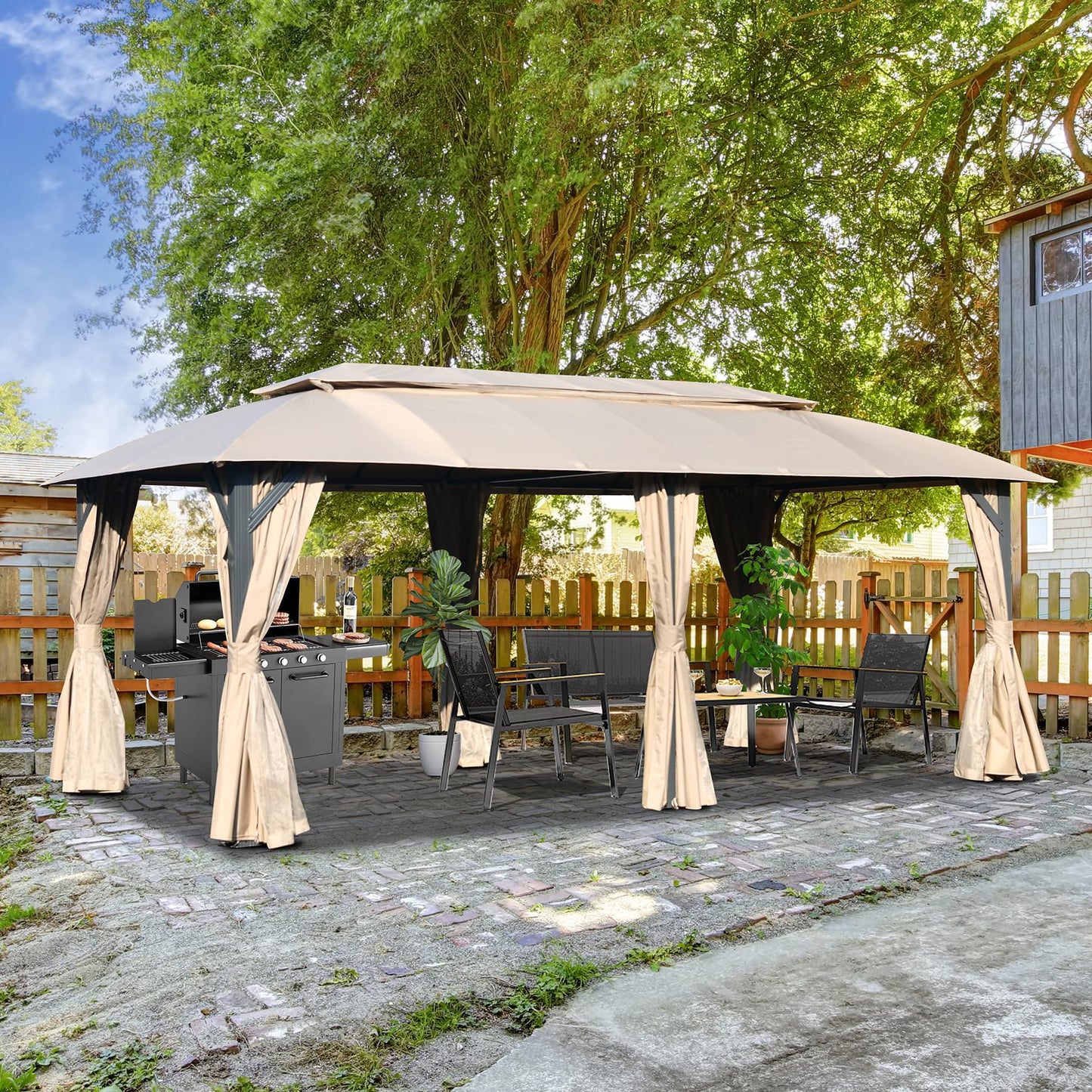 Beige outdoor gazebo with black frame featuring a grill and dining set for backyard entertaining