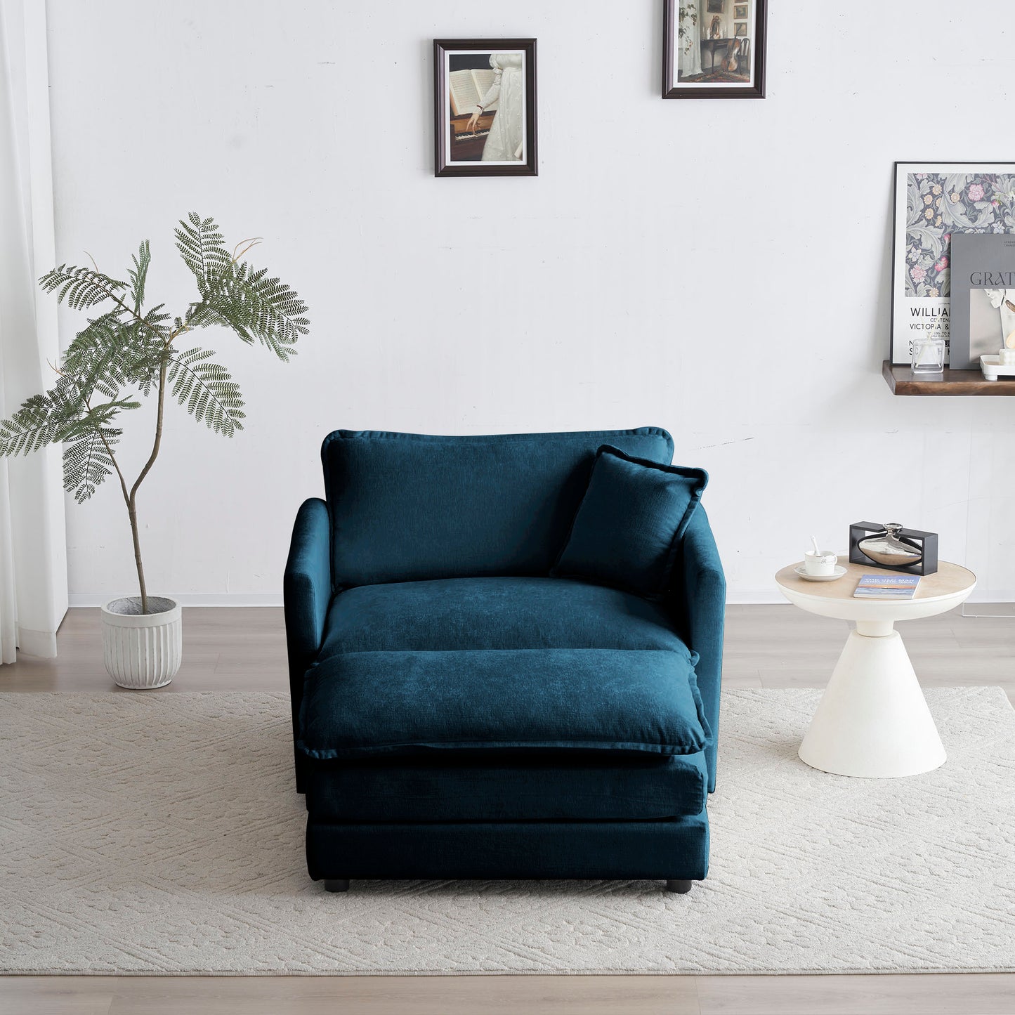 Teal velvet armchair with matching ottoman and throw pillow on a light rug