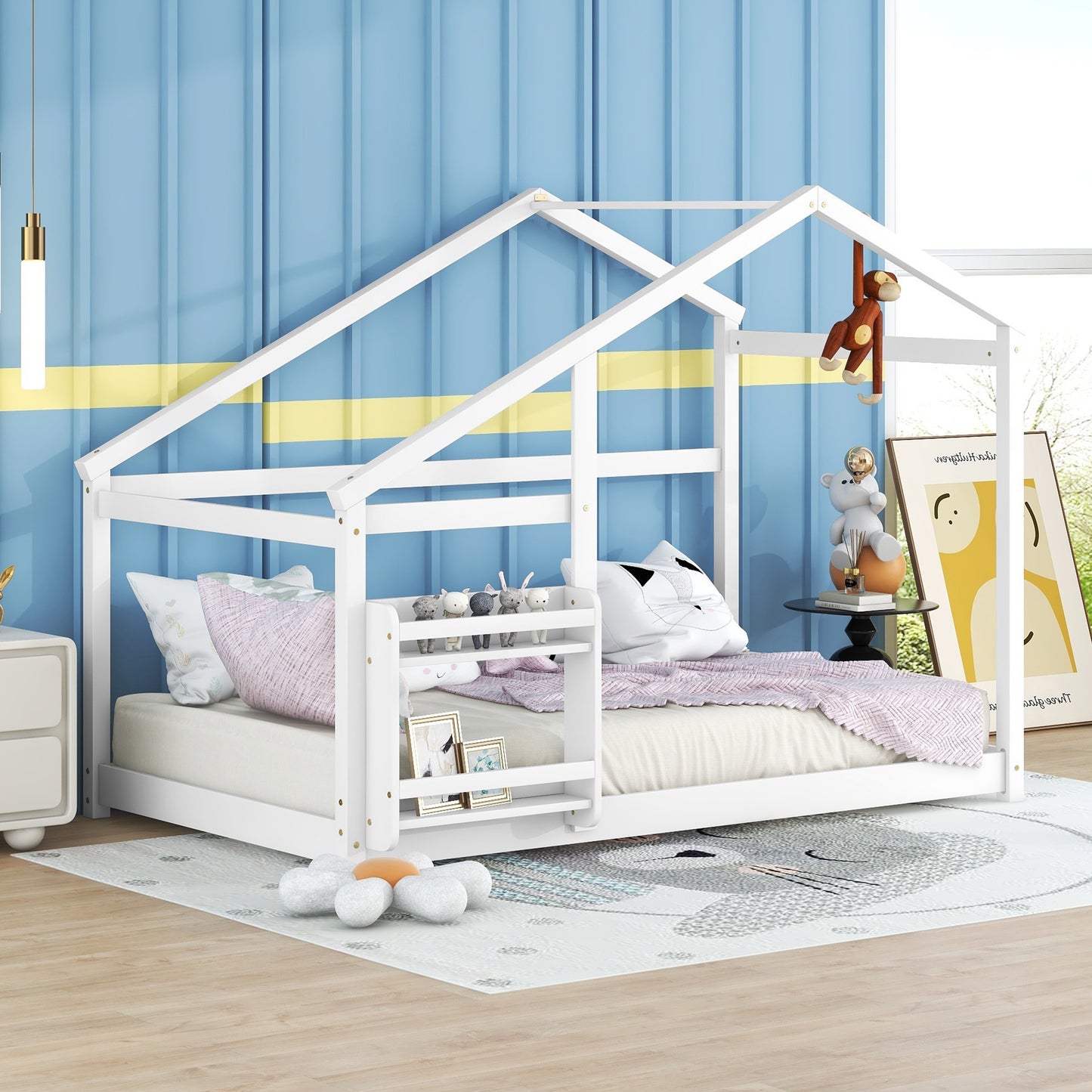White wooden house bed frame with playful monkey hanging