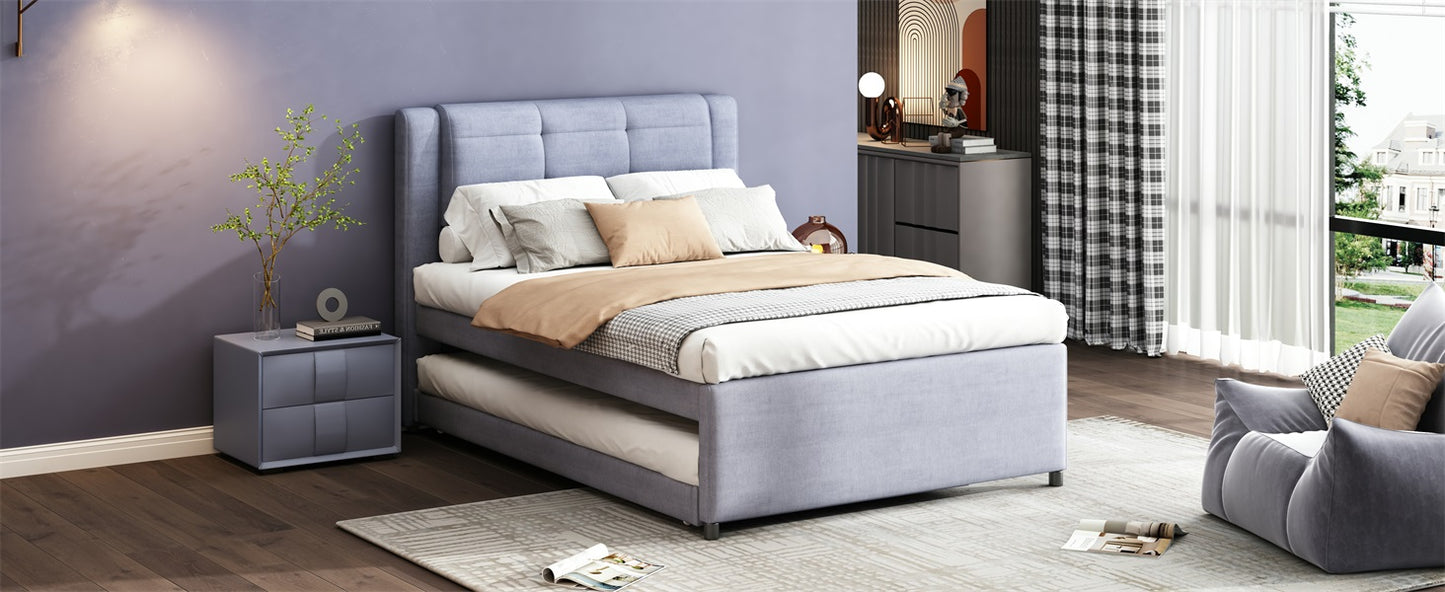 Light blue upholstered twin bed frame with a pullout trundle for guest sleeping