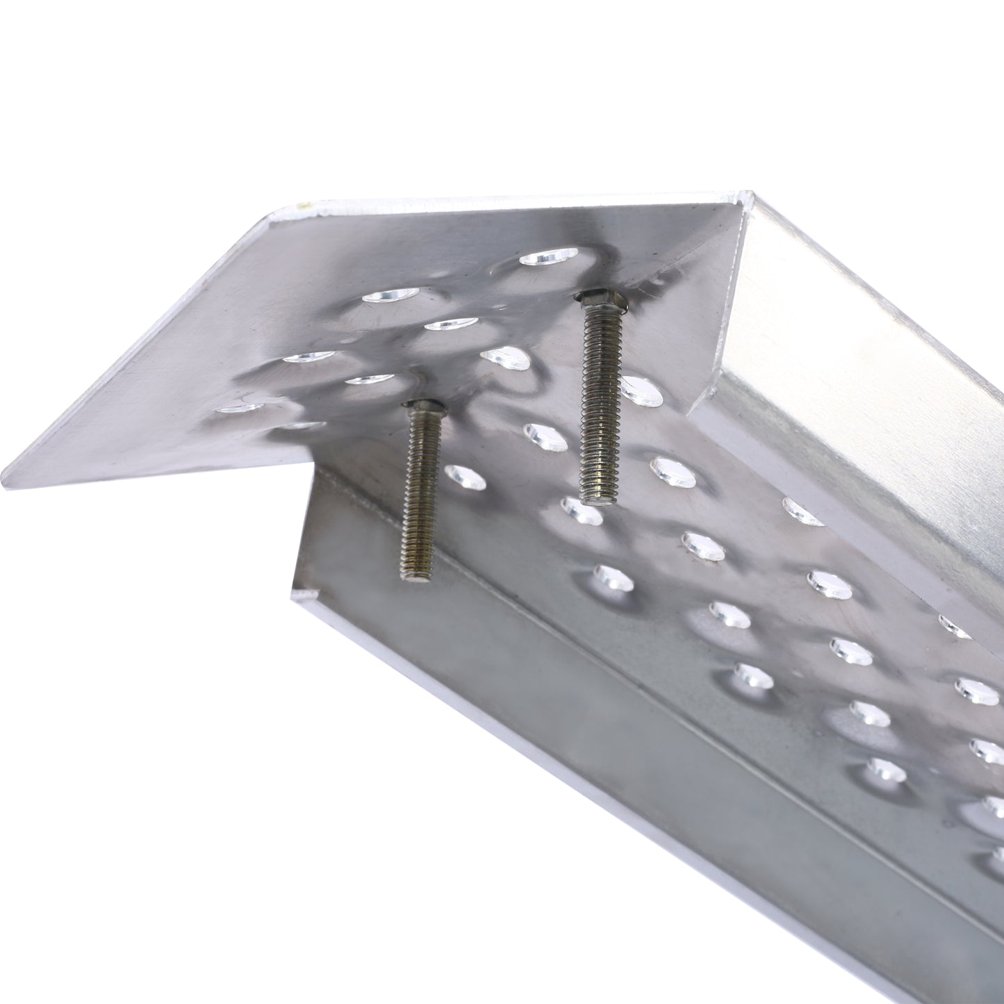 Closeup of a silver metal ramp section with raised dimples and two bolts