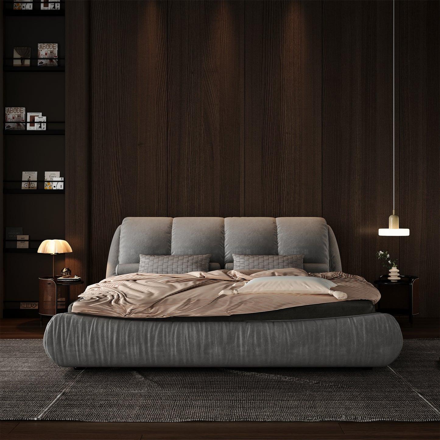 Plush grey upholstered bed with textured grey throw pillows and a striped duvet