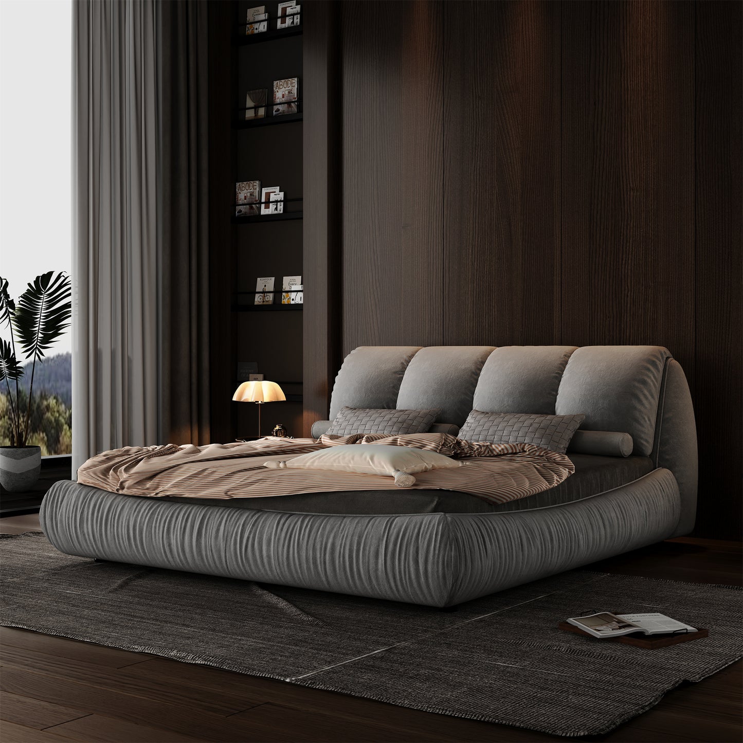 Plush grey fabric platform bed with oversized tufted headboard and striped bedding modern design