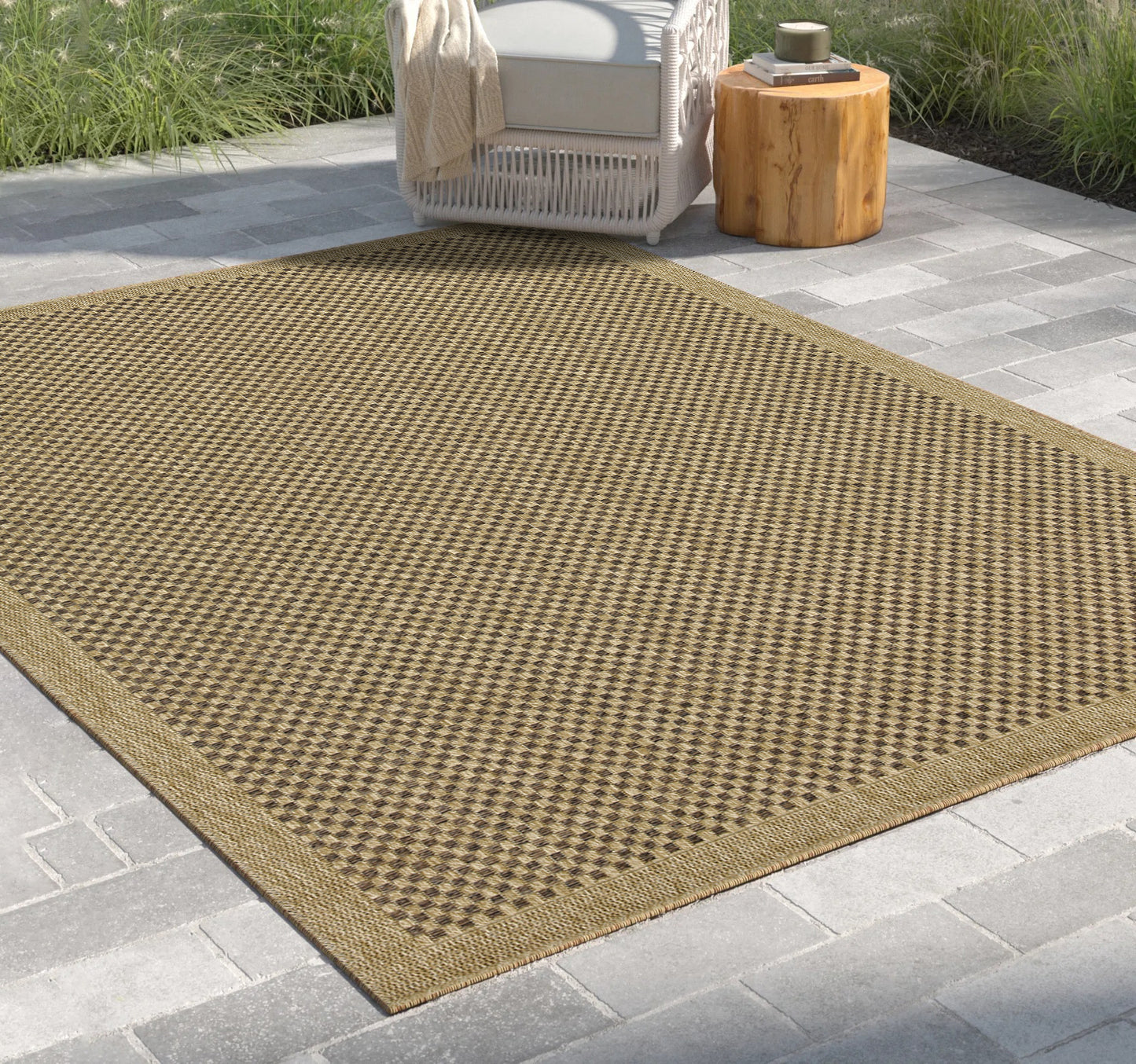 Tan and brown diamond pattern outdoor rug with woven texture