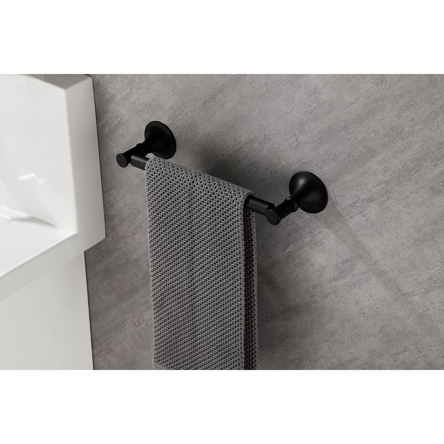 Matte black towel bar with a single bar and a textured grey towel