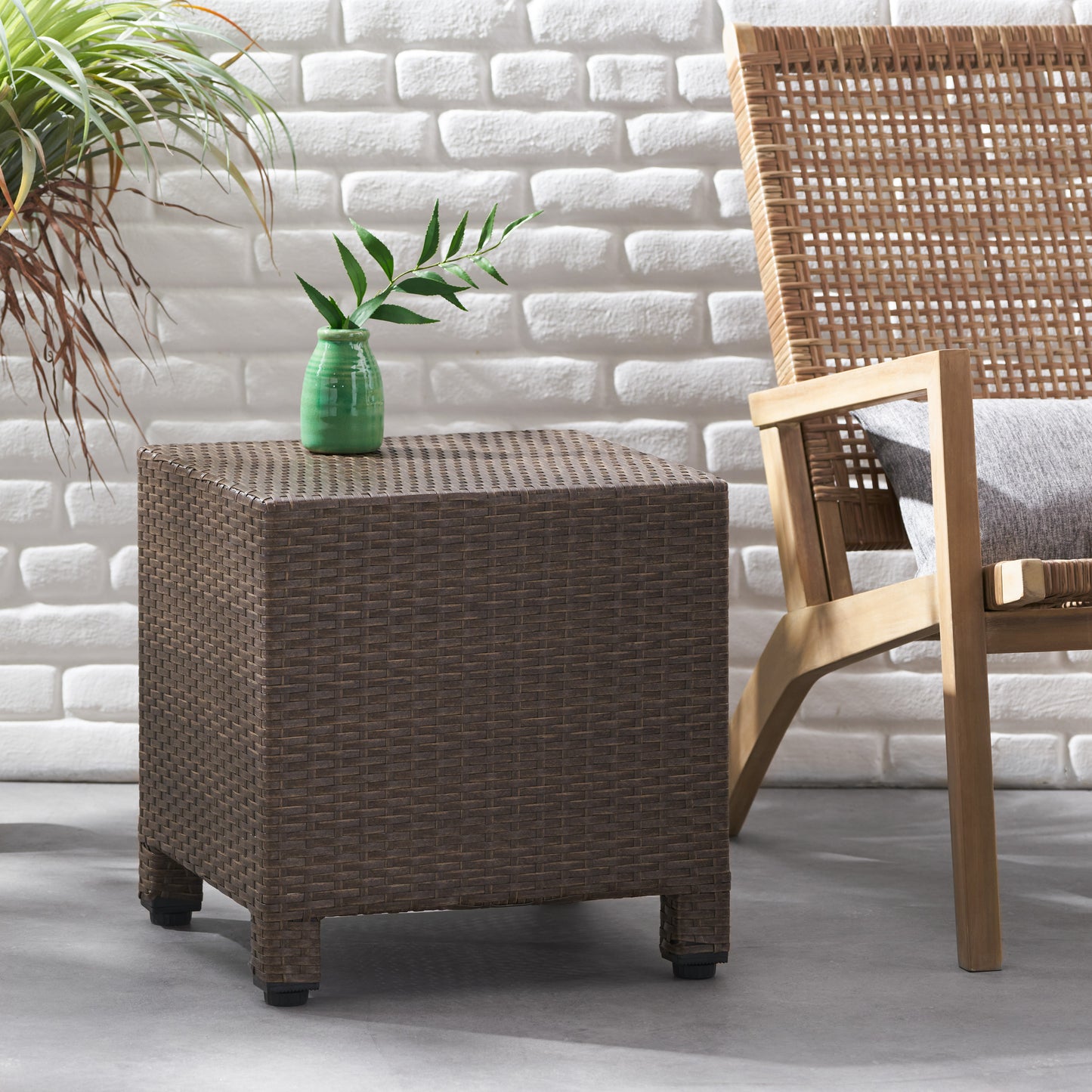 Brown wicker patio end table with a textured finish and cube design