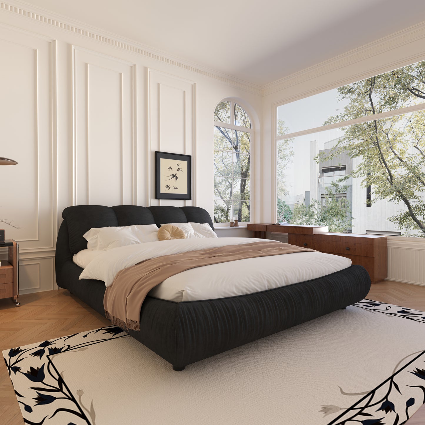Black fabric bed frame with tufted headboard and white bedding