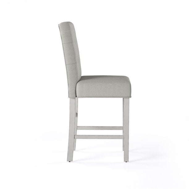 Side view of a gray upholstered bar stool with a white background