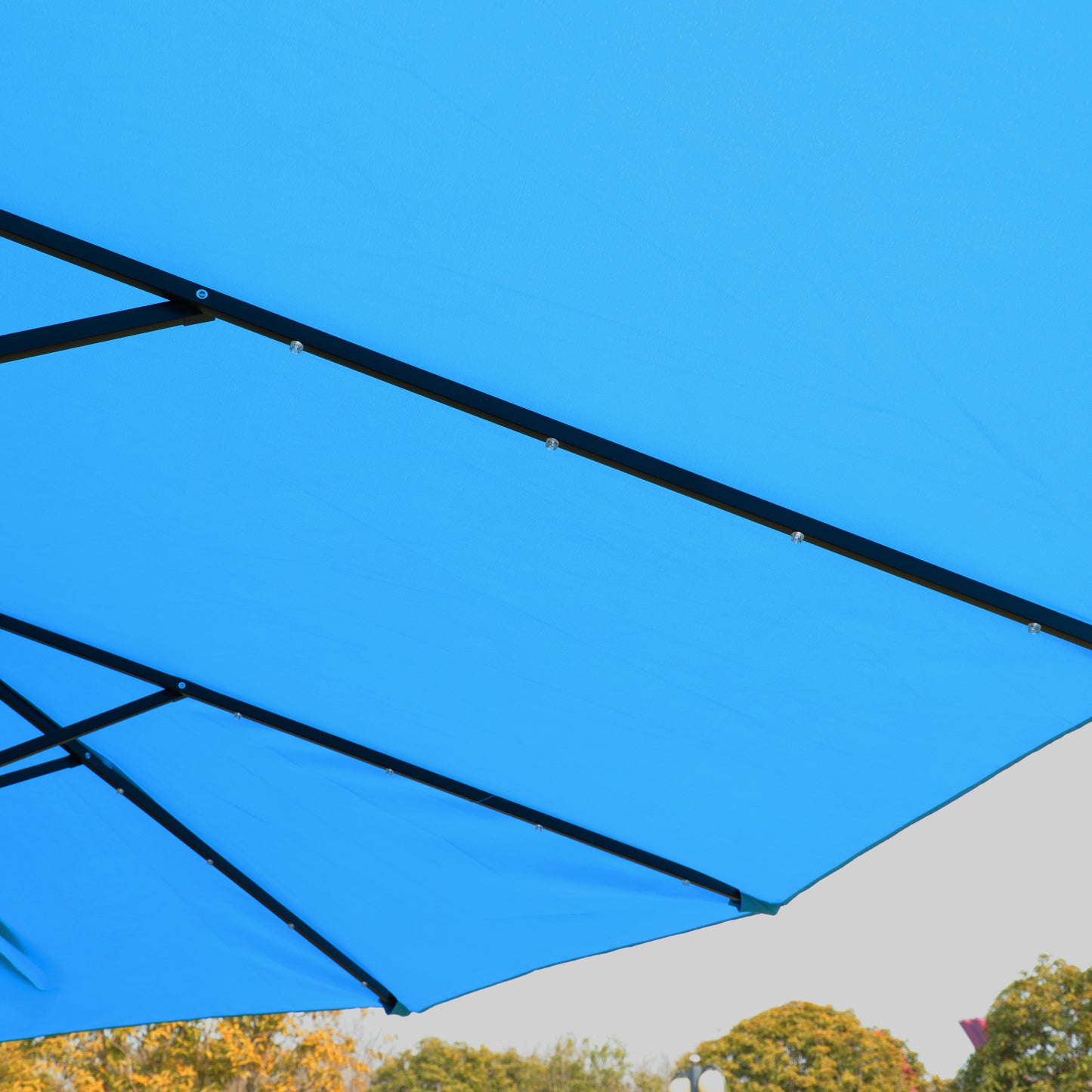 Blue patio umbrella canopy with black metal frame detail