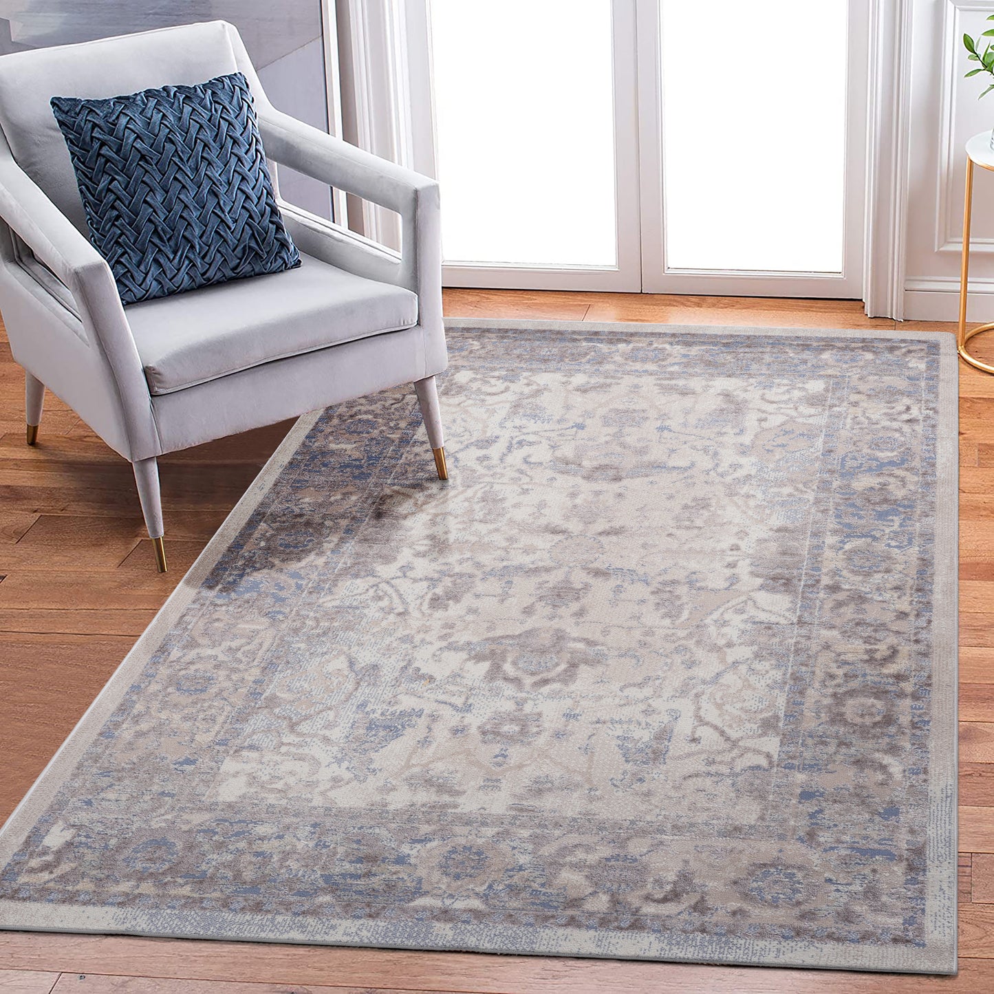Cream and blue distressed Persian rug with intricate floral patterns