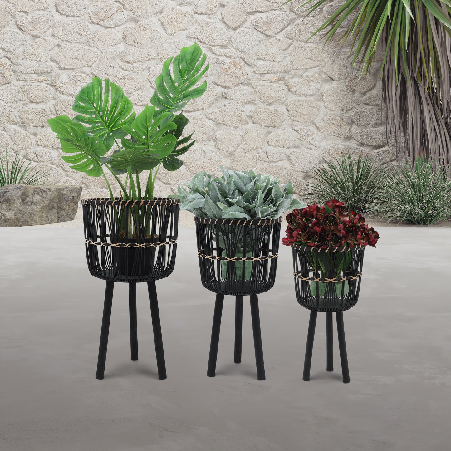 Black woven planter stand with Monstera plant modern outdoor decor