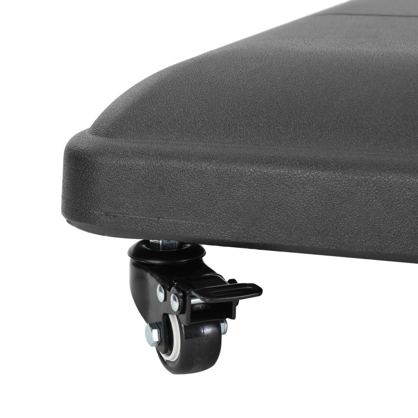 Closeup of a black textured rolling wheel with a lock on an outdoor furniture base