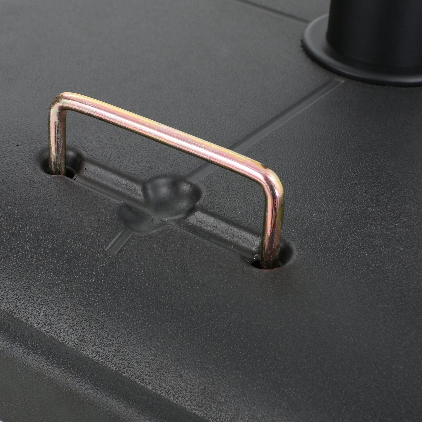 Black textured base with a gold metal carrying handle for umbrella stand stability