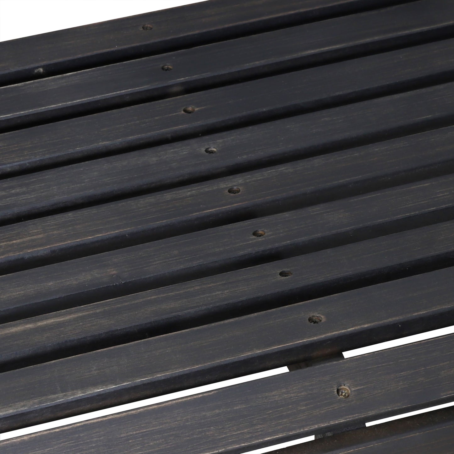 Dark grey slatted wooden bench detail with visible grain texture